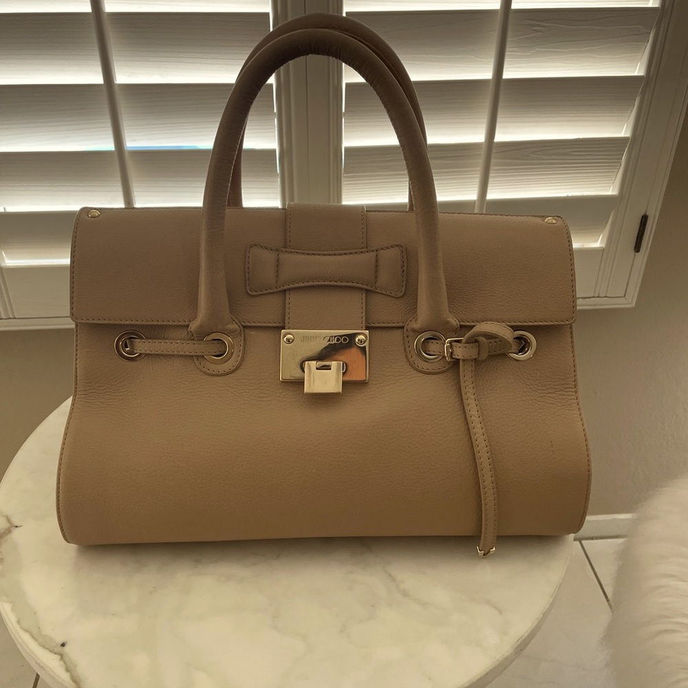 Jimmy Choo neutral camel colored bag.